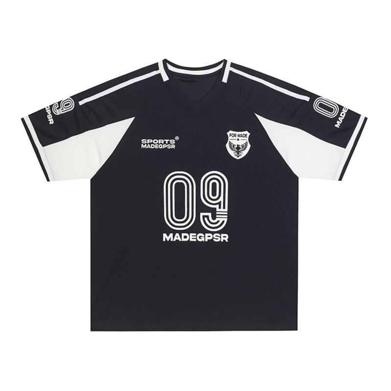 Black and white MADEGPSR 09 soccer jersey with V-neck, long sleeves, and bold street football graphics