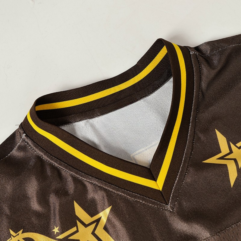 Brown varsity performance jersey with yellow striped collar and flame star graphic detail