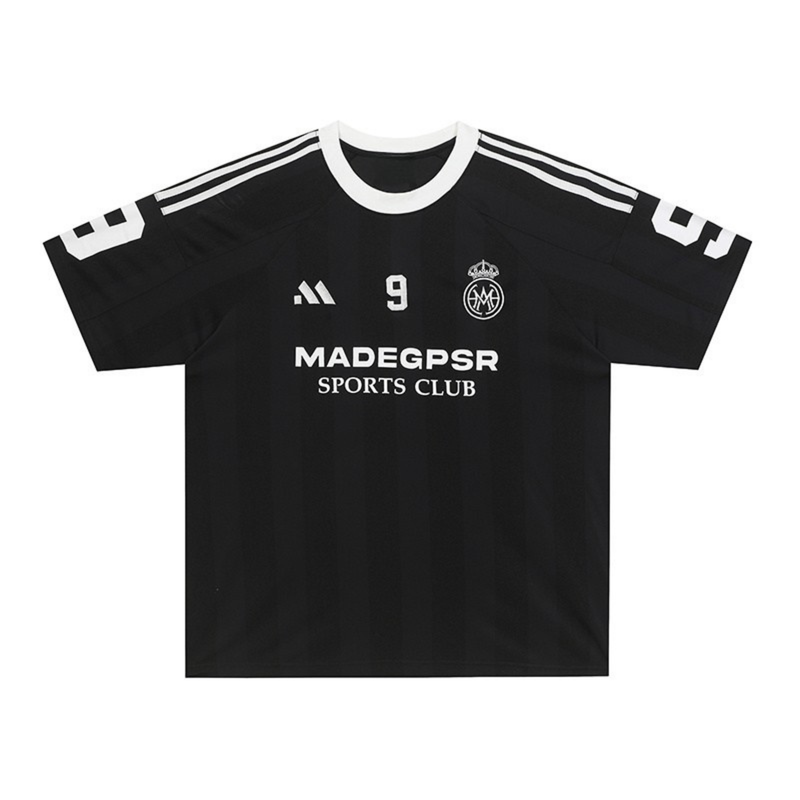 Black MADEGPSR sports club football jersey T-shirt with white trim, number 9, and chest logo on a clean background