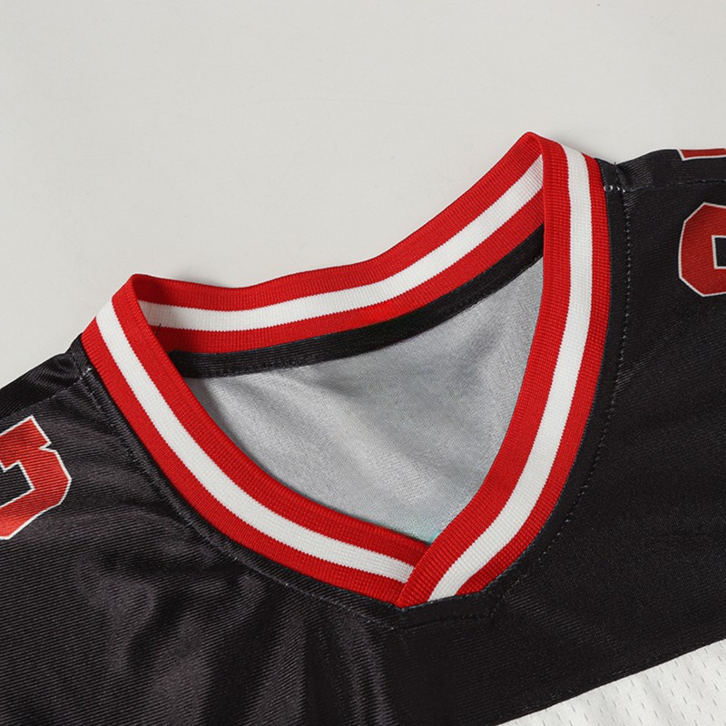 Black streetwear football jersey with red-and-white striped V-neck and bold number 03 detail