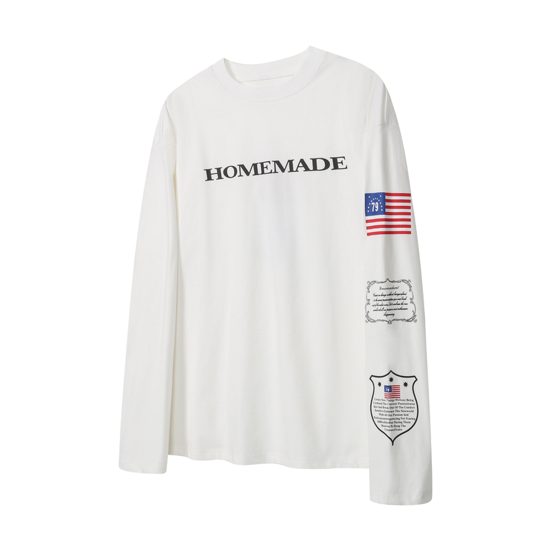 White long sleeve tee with HOMEMADE text and small flag graphics on the chest and sleeve
