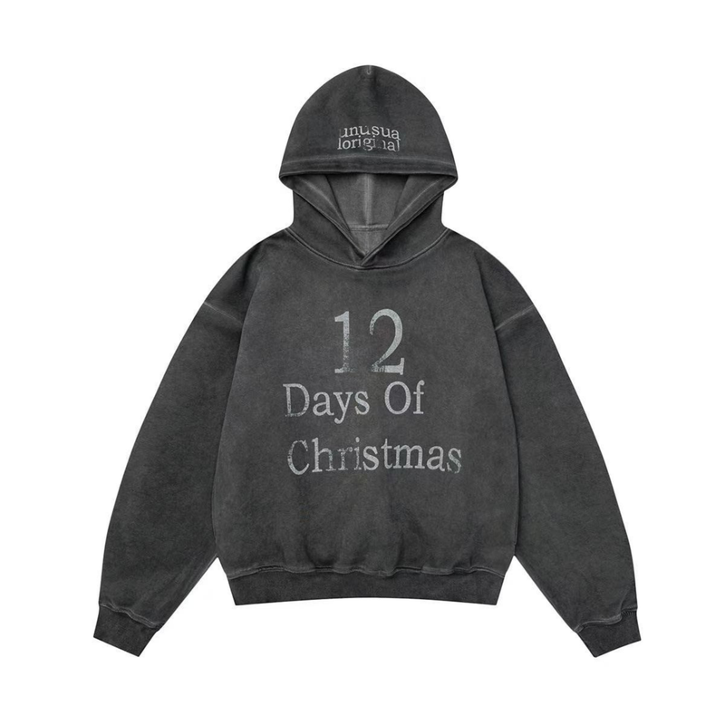 Front view of a black vintage washed pullover hoodie with 12 Days Of Christmas print on chest and hood