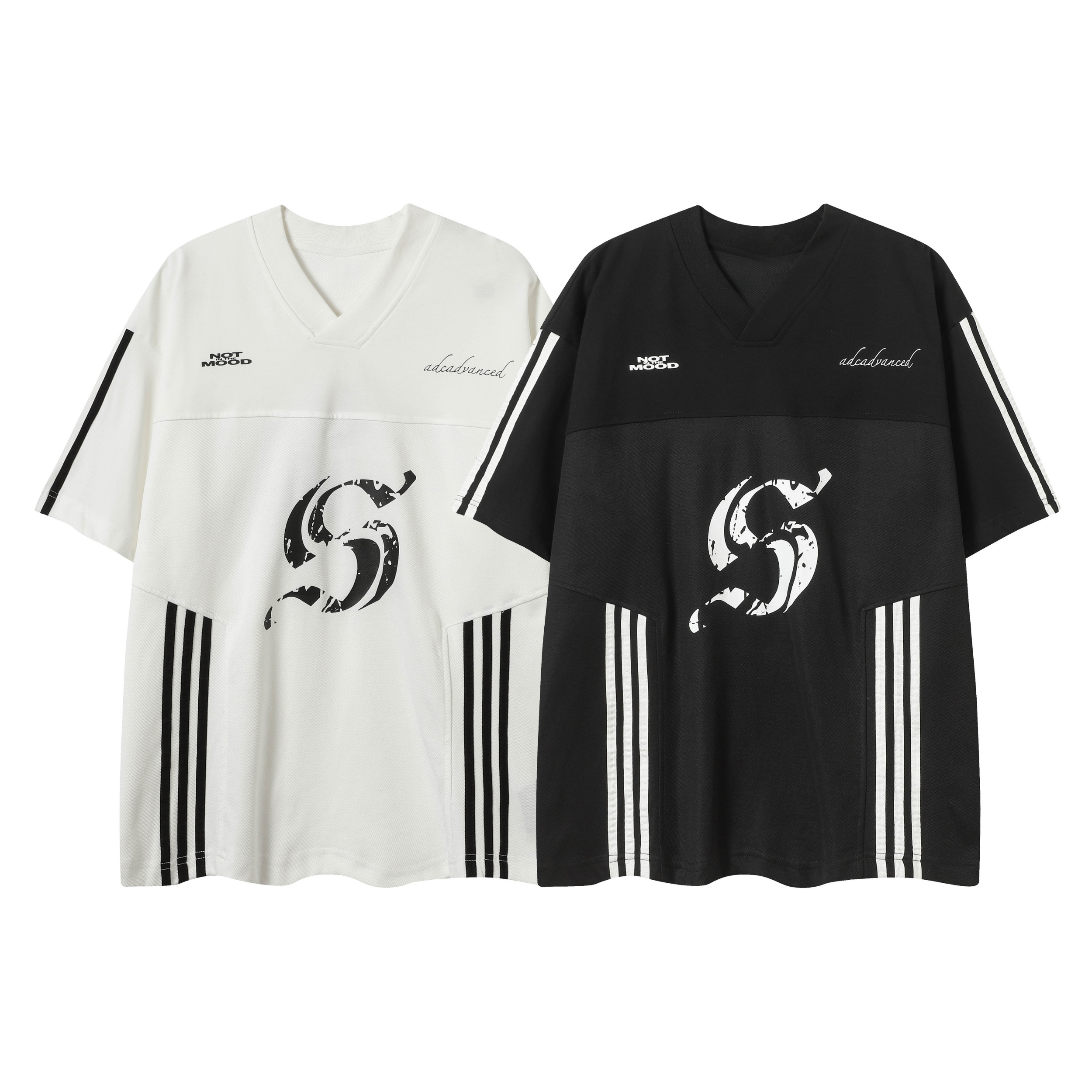 White and black oversized V-neck street tees with triple side stripes and distressed S graphic print, laid flat side by side