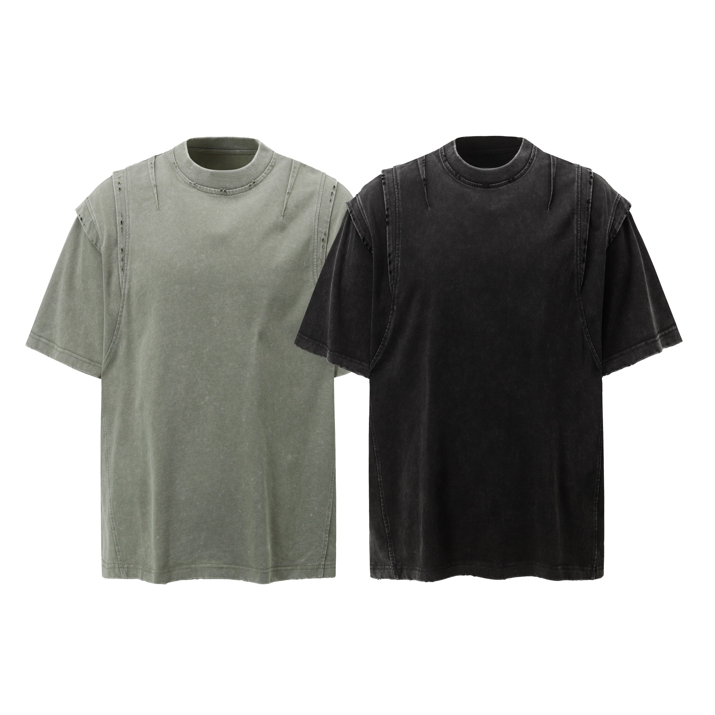 Two acid-washed oversized panel tees displayed flat — olive green and washed black colorways with structured shoulder seam de