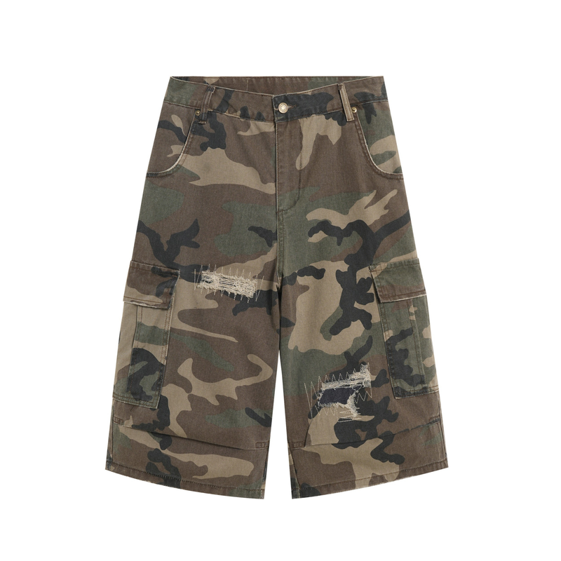 Front view of distressed camo cargo shorts with flap pockets and ripped thigh details