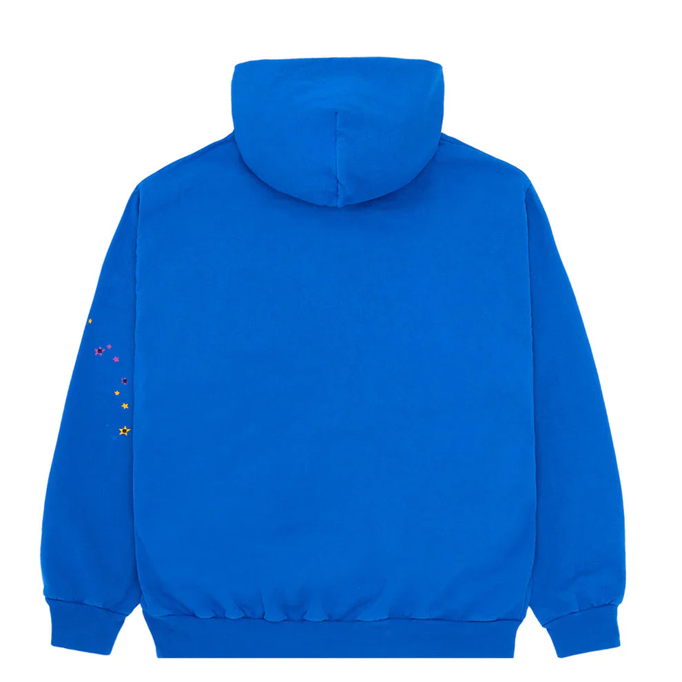 The Sp5der “Hares the Slime” Hoodie in royal blue is shown from the back, crafted from heavyweight (440GSM) cotton fleece, and features a fuzzy spider-web graphic logo with small colorful star accents on the sleeve.