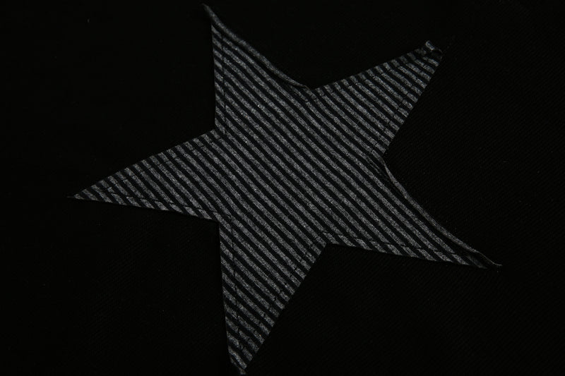 Black star panel detail with diagonal striped fabric texture