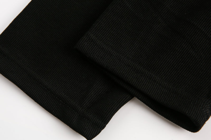 Close-up of black ribbed sleeve cuff