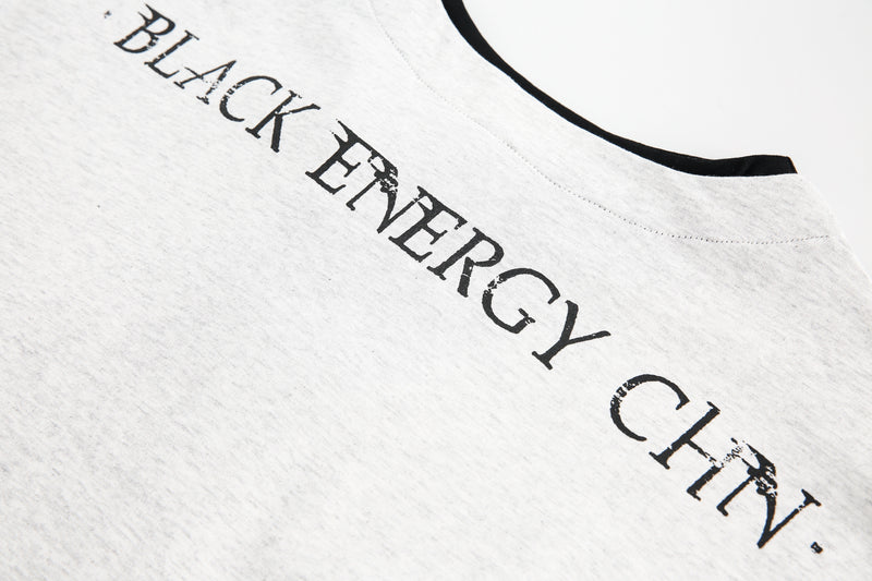 Upper back neckline text print on light gray long-sleeve tee
