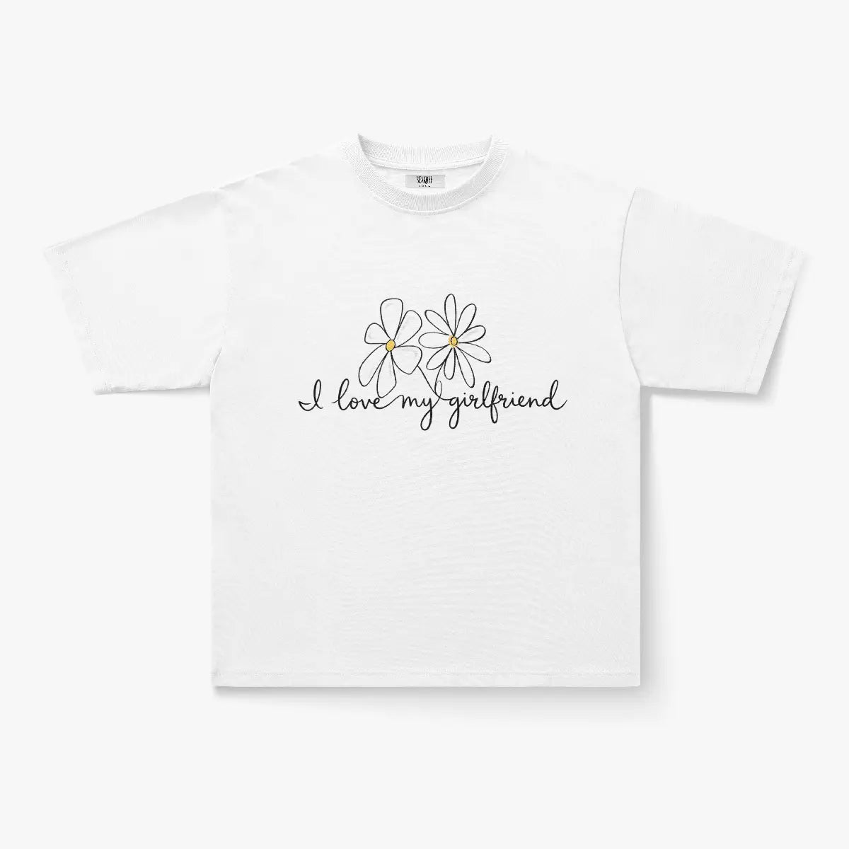 The I Love My Girlfriend Daisy Script Graphic Oversized White T-Shirt showcases two daisy graphics and handwritten text, making it perfect for soft-girl streetwear style.