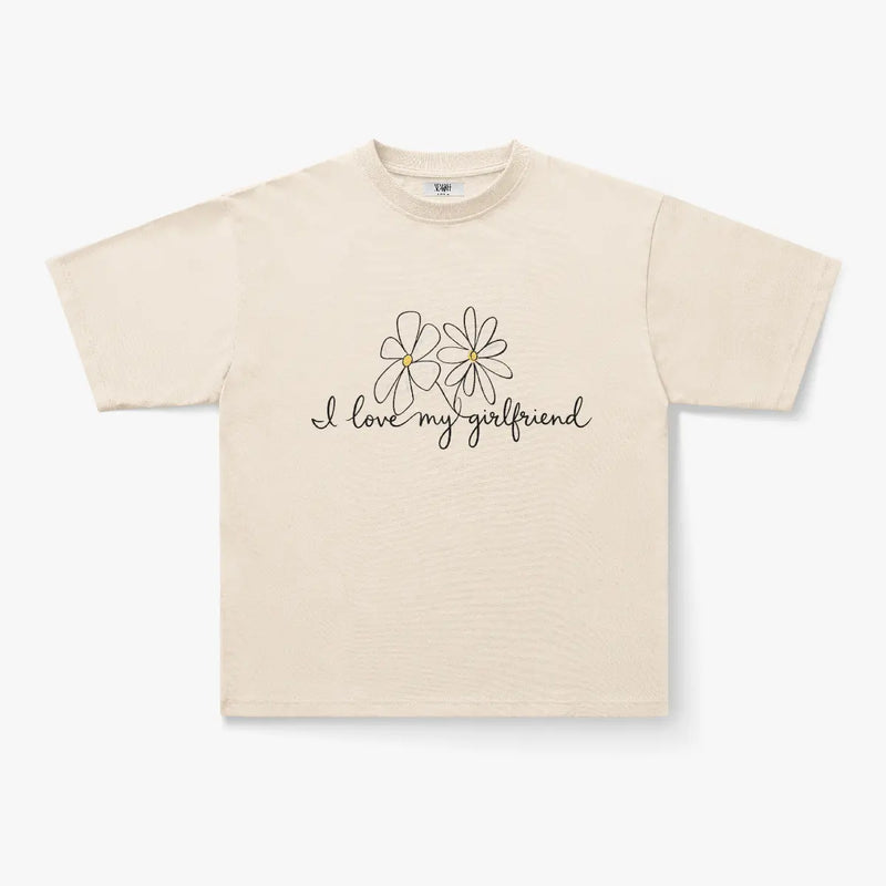 The "I Love My Girlfriend Daisy Script Graphic Oversized White T-Shirt" features two simple daisies on the front, making it perfect for soft-girl streetwear fans.