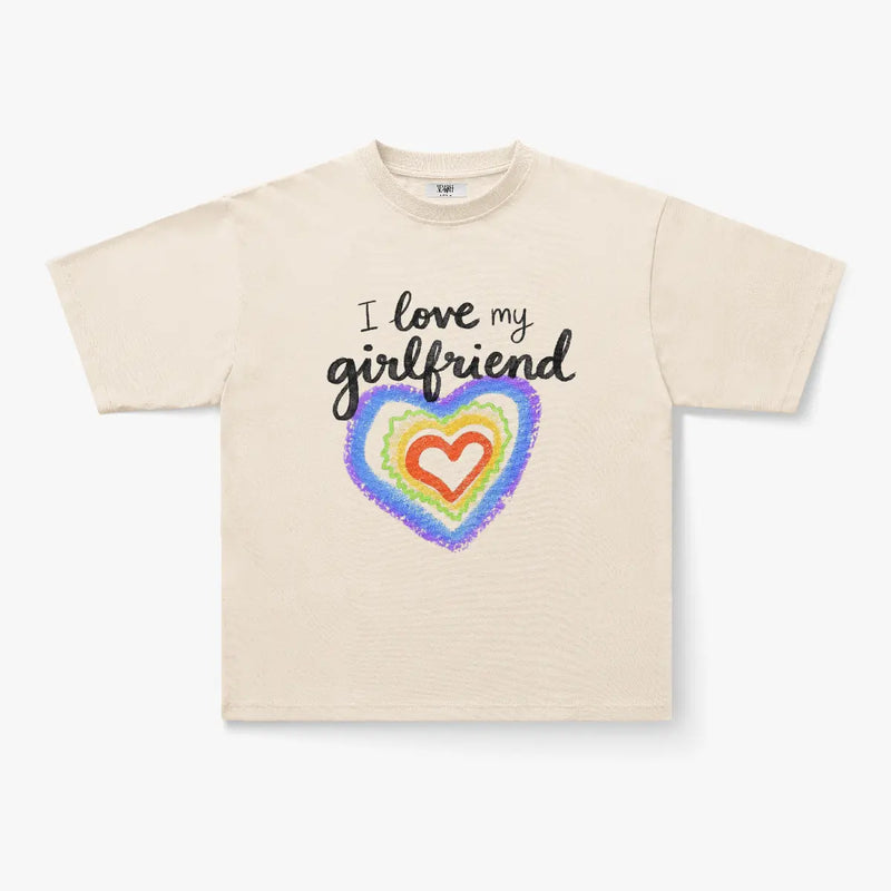The I Love My Girlfriend Rainbow Heart Graphic White T-Shirt features a colorful crayon-style heart and playful text, perfect for couples.