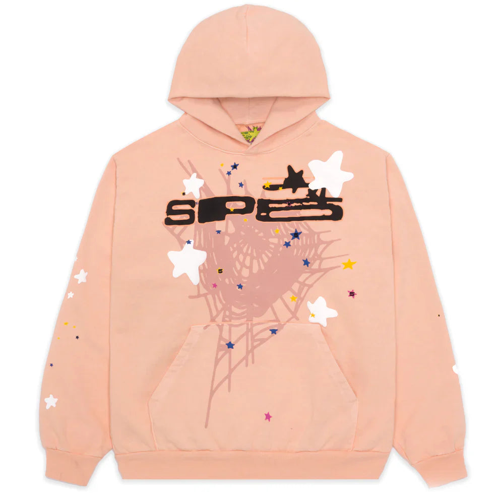 The Sp5der Star Web Hoodie – Peach Pink 440GSM Heavyweight Oversized Streetwear Pullover features a black abstract design, white and colored stars, and a large light pink web graphic—a standout Y2K streetwear piece.