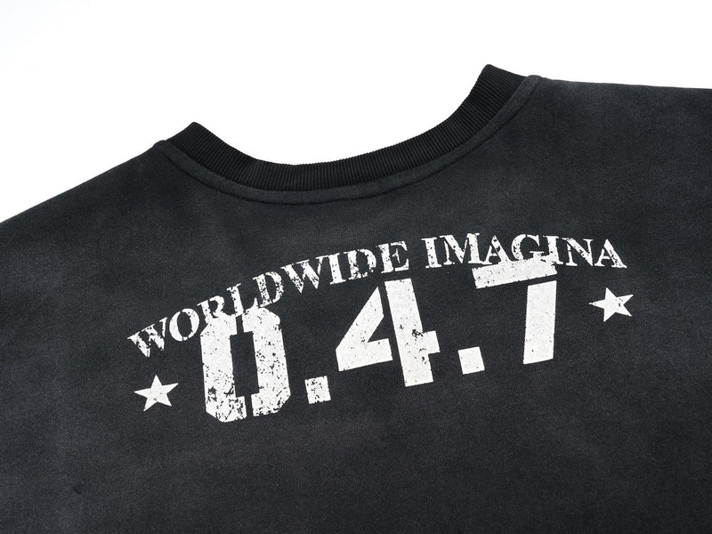 Close-up of black jersey neckline and upper chest with distressed 0.4.7 print