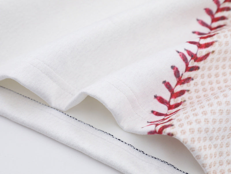 Close-up of white baseball stitch mesh tee with red lace print and visible jersey hem stitching
