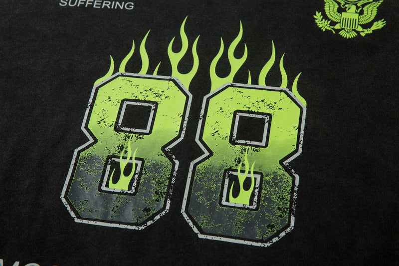 Close-up of neon green flaming 88 graphic on black tee front