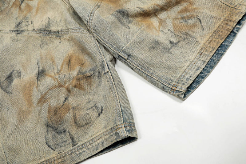 Close-up of hem and lower leg of spray-dyed wide-leg denim shorts