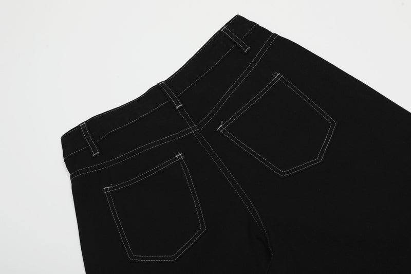 Upper back of black cargo shorts showing rear pockets and waistband stitching