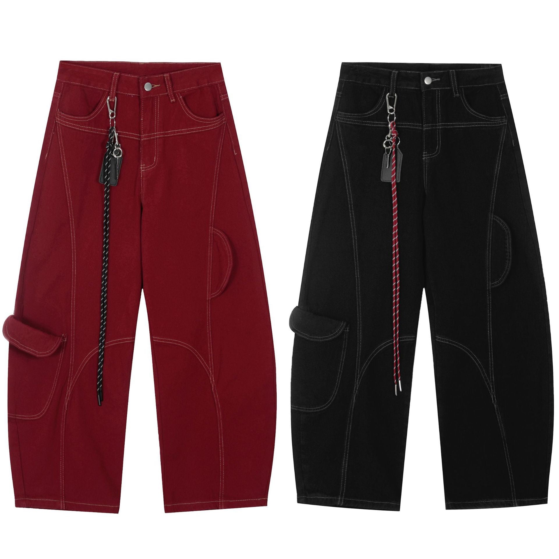 Black wide-leg cargo pants with white contrast arc stitching, side flap pocket, and detachable red rope keychain, flat lay on