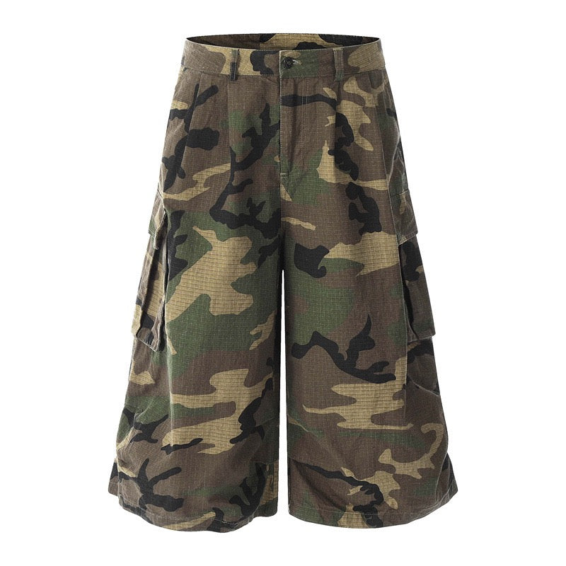 Woodland camo wide-leg cargo shorts shown from the front