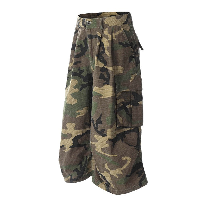 Woodland camo cargo shorts angled front view with side pocket flap