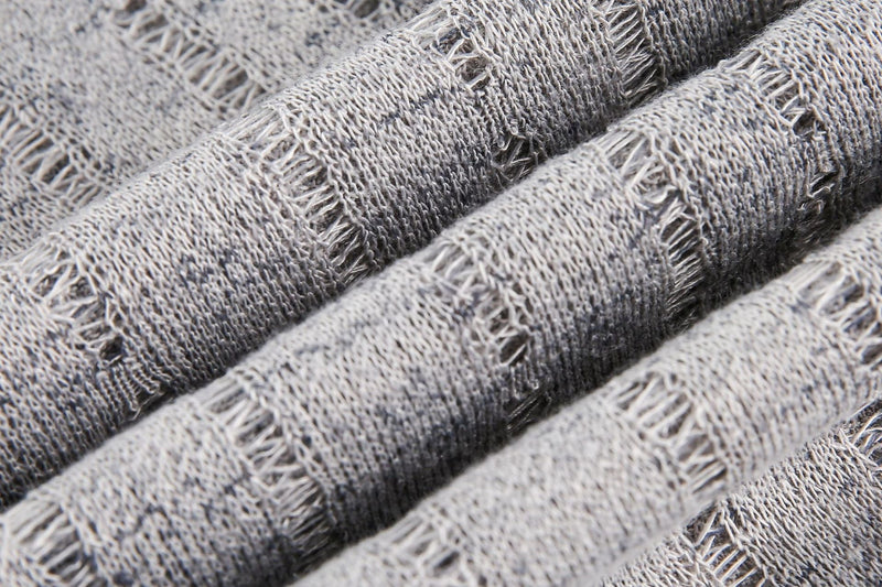 Close-up of gray plaid mesh fabric with frayed texture for a vintage streetwear tee