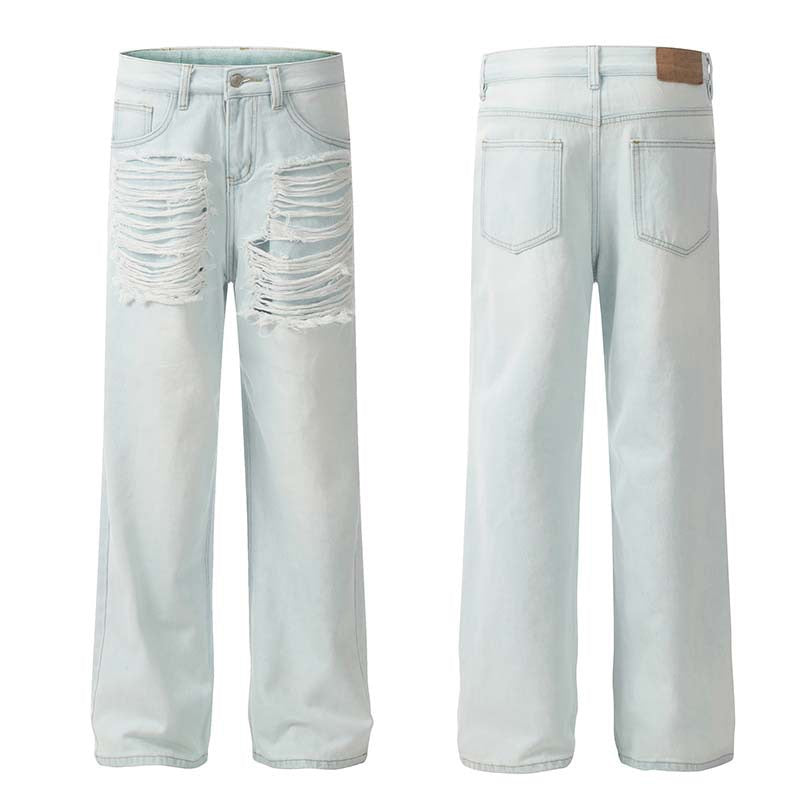 Front and back view of light-wash wide-leg jeans with heavy shredded distressing across both thighs