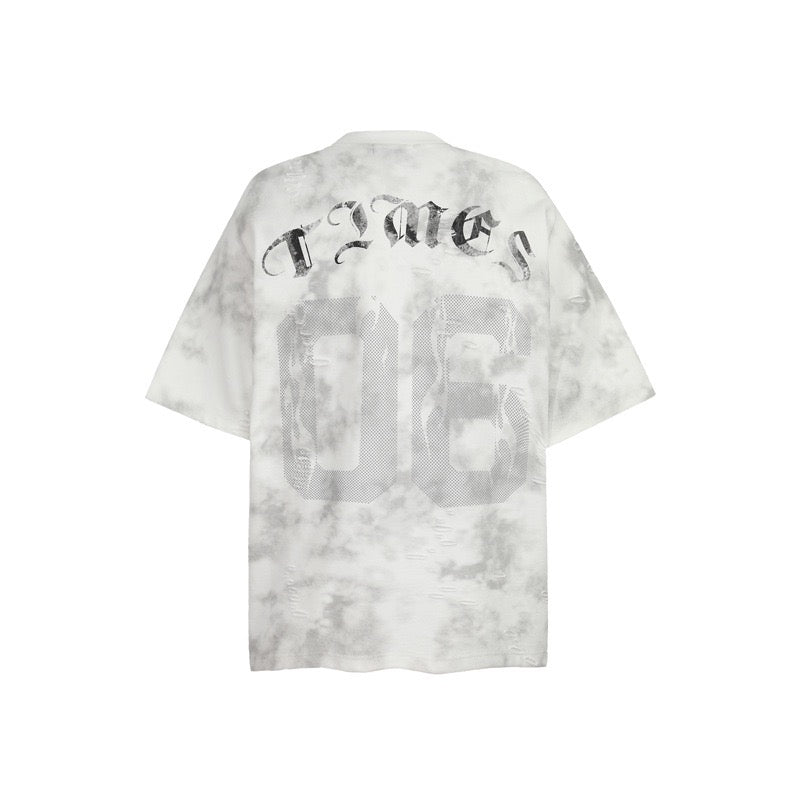 Oversized marble wash tee with faded black number 06 graphic and gothic text on the back