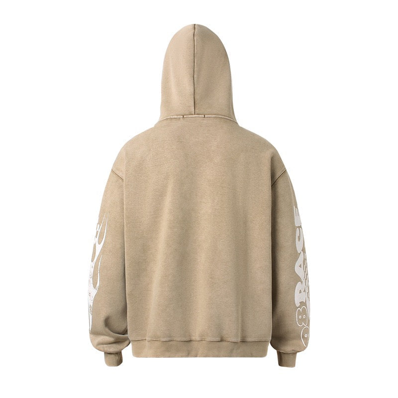 Back view of beige zip hoodie with hood up and sleeve graphics