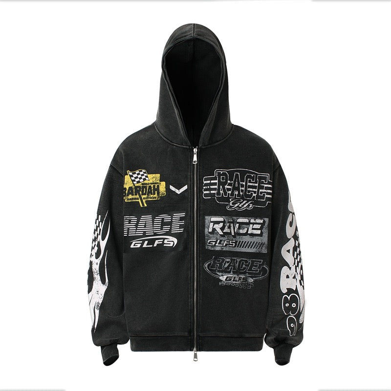 Black zip-up hoodie with distressed racing graphic prints, checkered flag patches, and flame sleeve detailing, front view