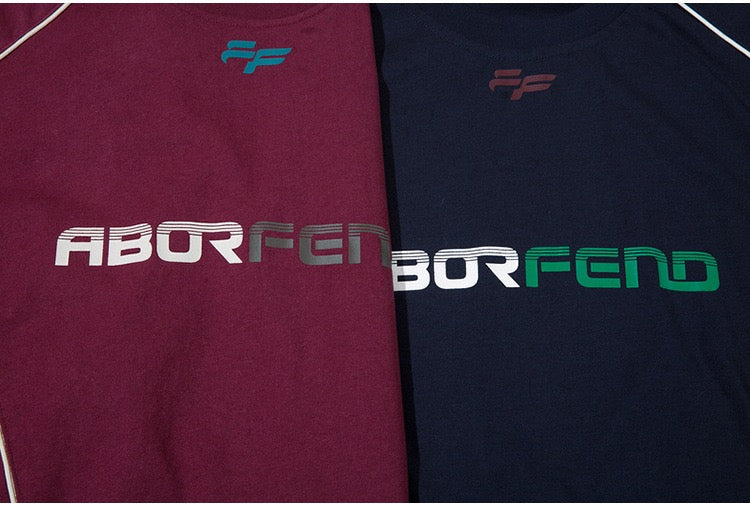 Oversized Seakoff ABORFEND jersey tees in burgundy and black with bold front logo print and paneled streetwear style
