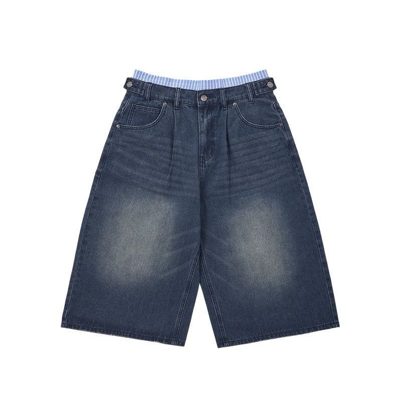 Omirad vintage wide-leg denim shorts in medium blue wash with striped inner waistband detail, flat lay on white background