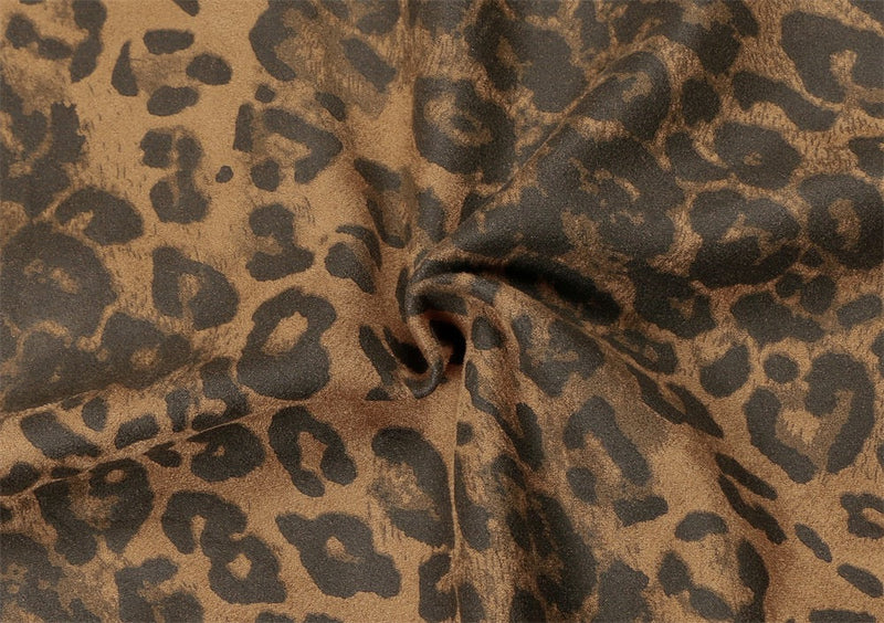 Close-up of leopard print fabric gathered into a seam with soft textured finish