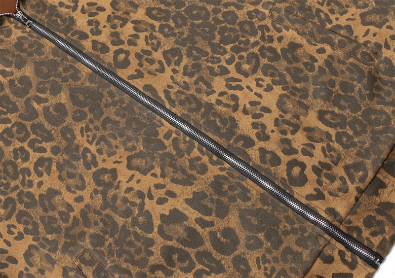 Front of leopard print track jacket with diagonal zipper and chest pocket detail