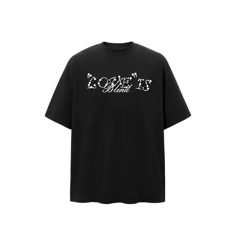 Black oversized crew neck t-shirt with pearl rhinestone Love Is Blind script graphic on the chest