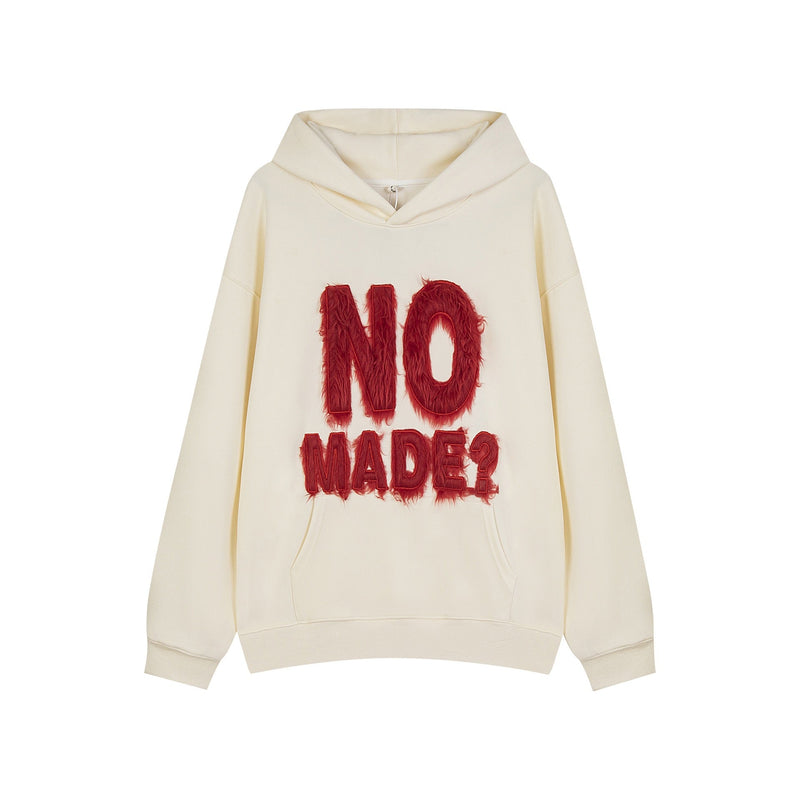 Cream hoodie front view with red furry NO MADE? lettering on the chest