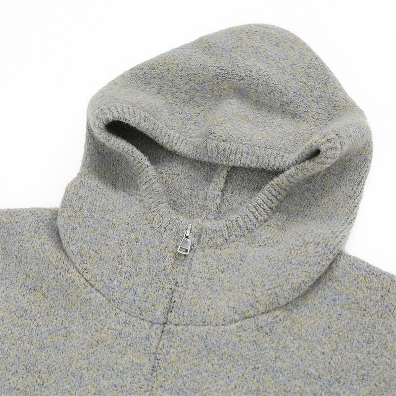 Close-up of light gray hood with front zipper at the neckline