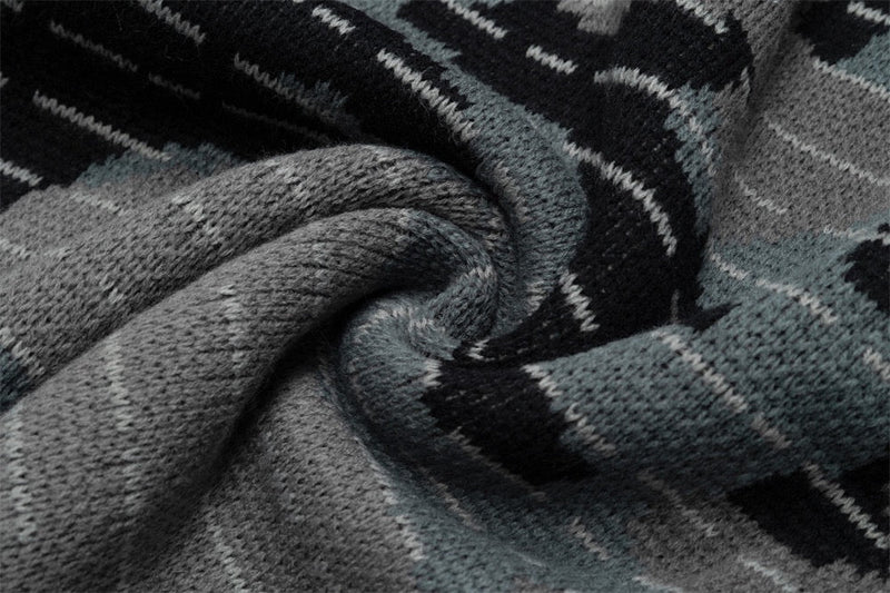 Close-up of gray and black camo knit fabric texture