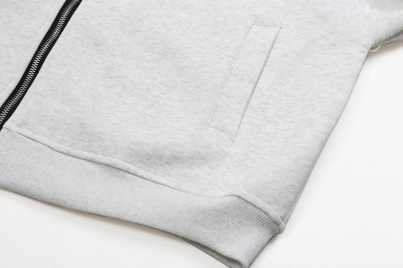 Ash grey hoodie front hem with zipper, kangaroo pocket, and ribbed waistband