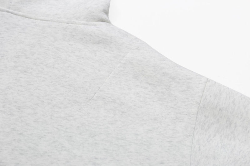 Ash grey hoodie shoulder and upper sleeve seam close-up