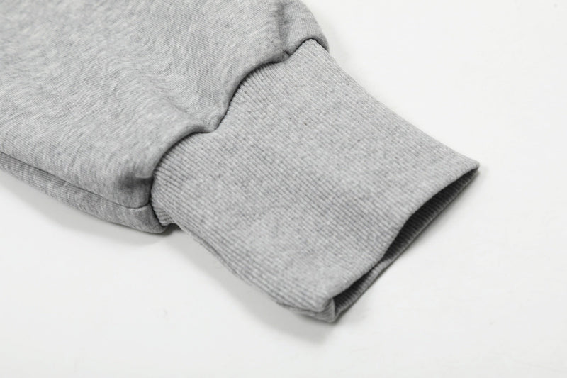 Close-up of gray hoodie sleeve cuff and ribbed knit wrist