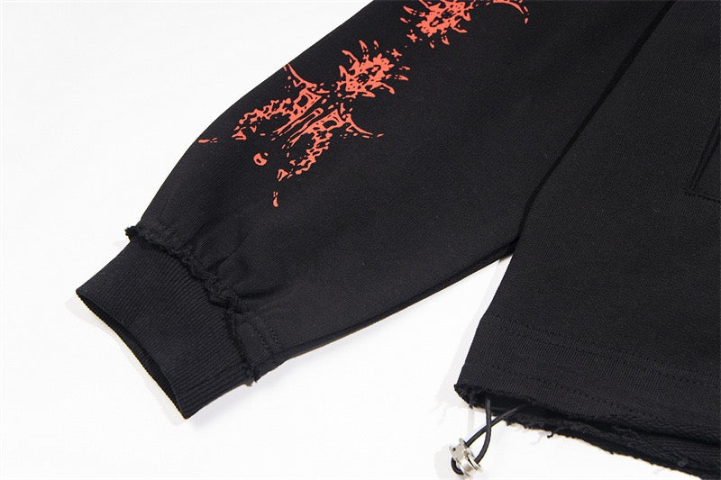 Close-up of black hoodie sleeve cuff and adjustable hem drawstring