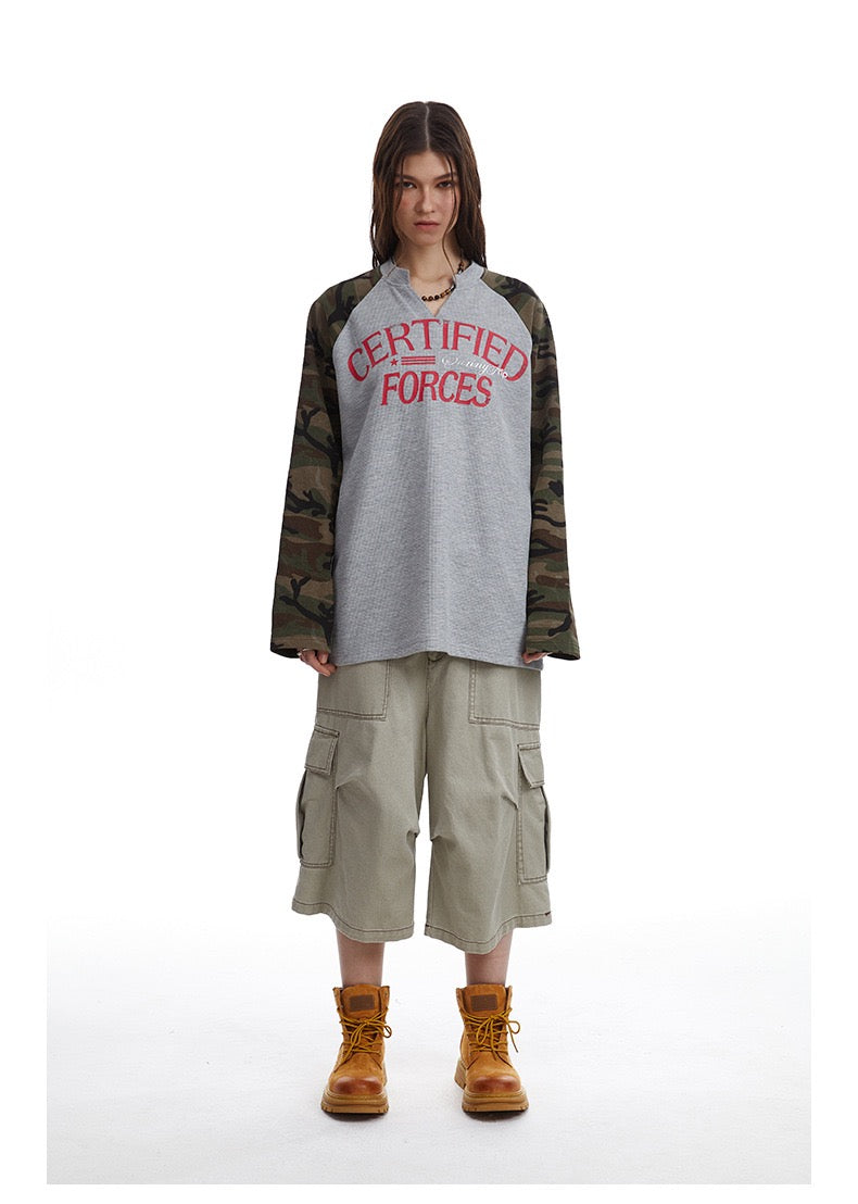 Full-length model view of gray camouflage raglan thermal tee with red Certified Forces print