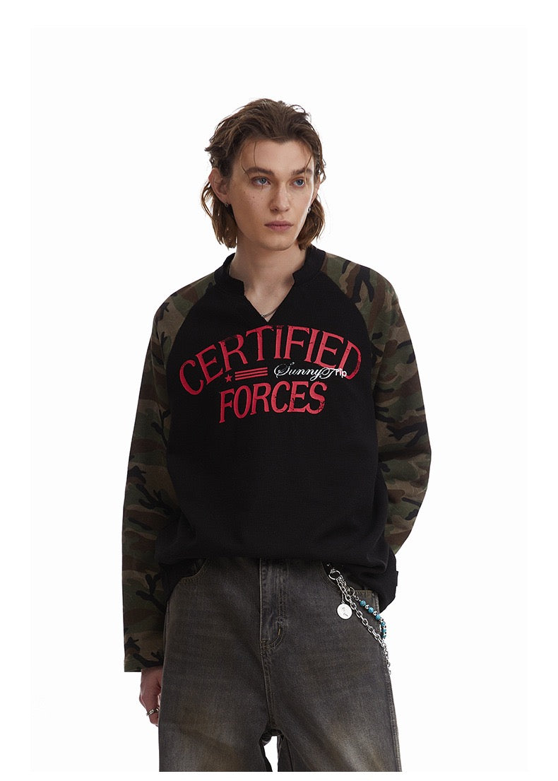 Close front view of black raglan thermal tee with camouflage sleeves and red Certified Forces graphic