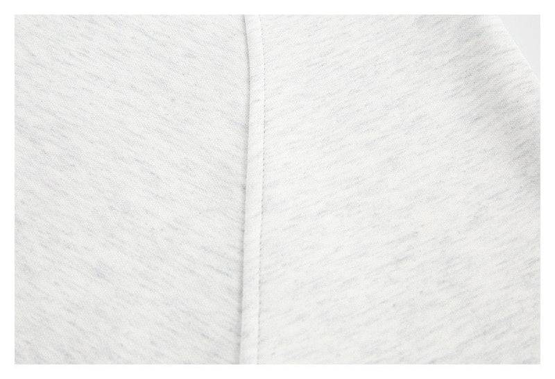 Close-up of light gray heathered fabric seam
