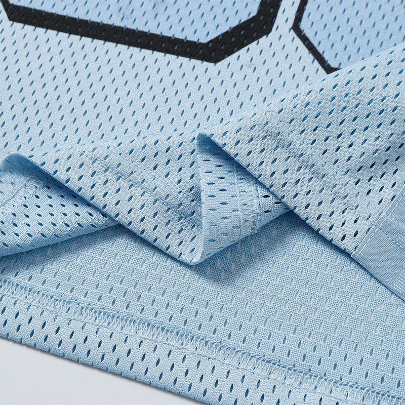 Light blue mesh varsity jersey tee fabric with stitched hem and black athletic trim detail