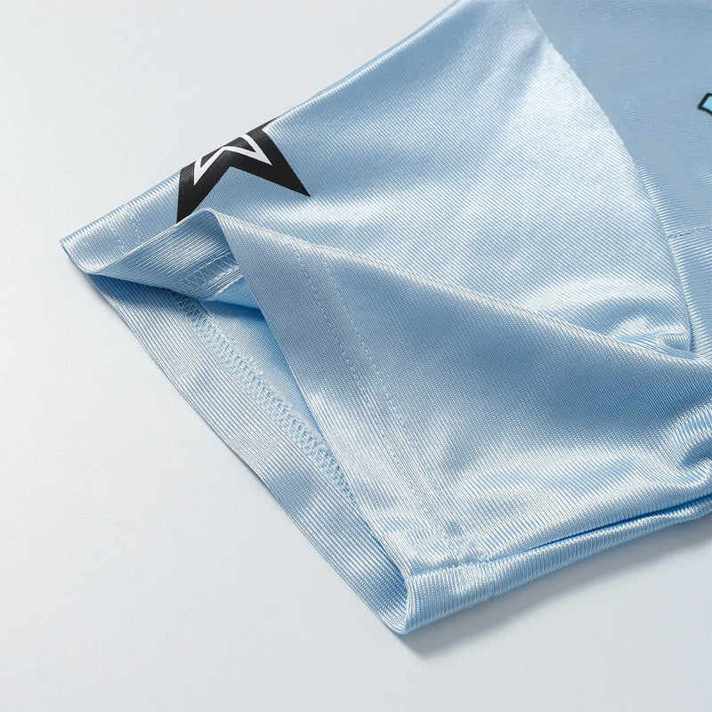 Light blue mesh varsity jersey with folded sleeve and black star logo detail