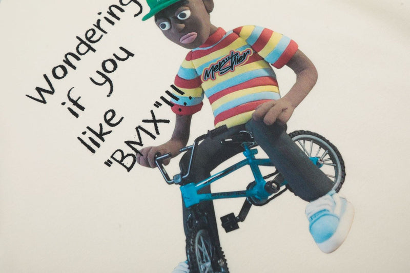 Front graphic close-up showing striped character on a bicycle with text
