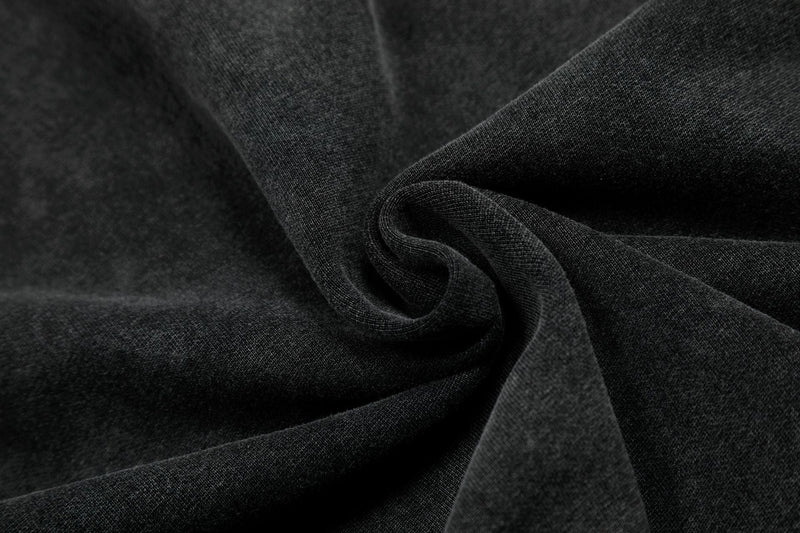 Close-up of dark charcoal hoodie fabric texture and folded drape
