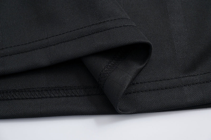 Black mesh athletic tee with triple-stitched hem and folded sleeve detail on a clean white background